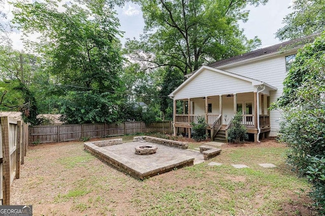 175 Pinecrest Ct, Athens, GA 30605 - fenced backyard featuring an outdoor fire pit, ceiling fan, a patio area, and a wooden deck