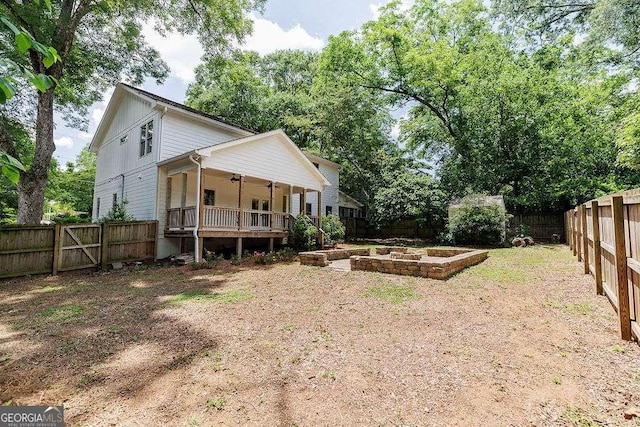 175 Pinecrest Ct, Athens, GA 30605 - back of house with ceiling fan, a fenced backyard, and a vegetable garden