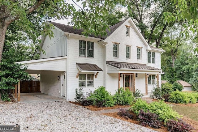 175 Pinecrest Ct, Athens, GA 30605 - view of front of property with a standing seam roof, driveway, board and batten siding, a metal roof, and a carport