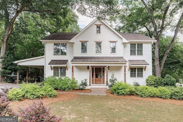 175 Pinecrest Ct, Athens, GA 30605 - view of front of home with a standing seam roof, a front yard, and a metal roof