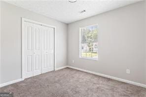 5484 Denny Dr, Atlanta, GA 30349 - unfurnished bedroom featuring carpet flooring and a closet
