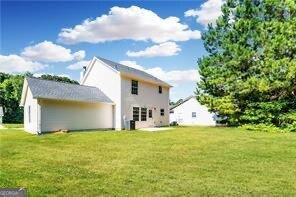 5484 Denny Dr, Atlanta, GA 30349 - back of house with a lawn