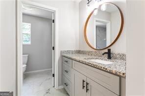 5484 Denny Dr, Atlanta, GA 30349 - bathroom with vanity and marble look tiles