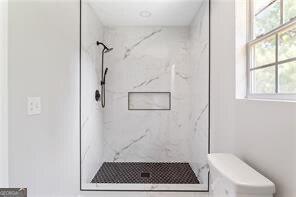 5484 Denny Dr, Atlanta, GA 30349 - bathroom featuring a marble finish shower