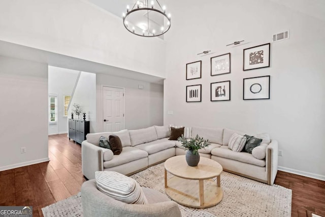 1825 Millstone Ct, Alpharetta, GA 30004 - living room with a chandelier, wood finished floors, and a high ceiling