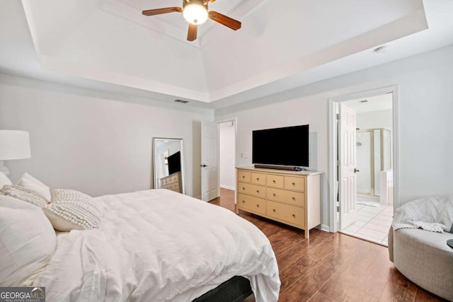 1825 Millstone Ct, Alpharetta, GA 30004 - bedroom featuring a tray ceiling, wood finished floors, a ceiling fan, and ensuite bath
