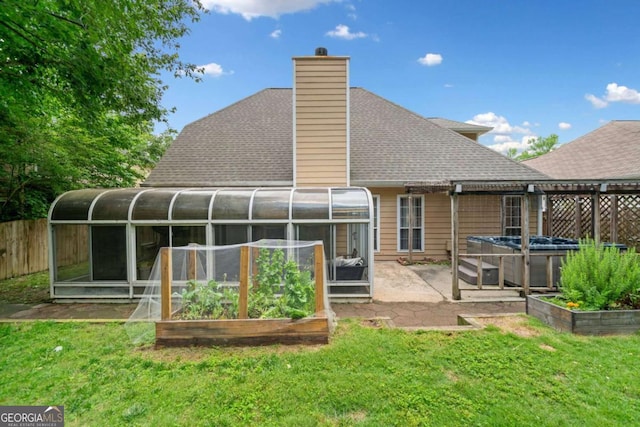 1825 Millstone Ct, Alpharetta, GA 30004 - back of property with a sunroom, a hot tub, roof with shingles, and a chimney