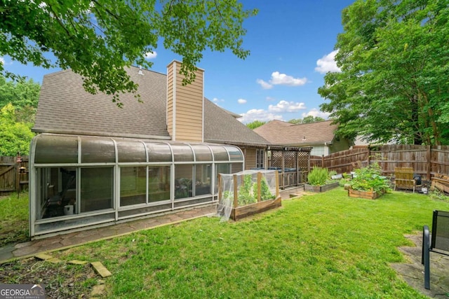 1825 Millstone Ct, Alpharetta, GA 30004 - view of yard featuring a sunroom and a vegetable garden