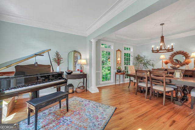 100 Castlebrook Chase, Tyrone, GA 30290 - dining area featuring decorative columns, wood finished floors, a chandelier, and ornamental molding