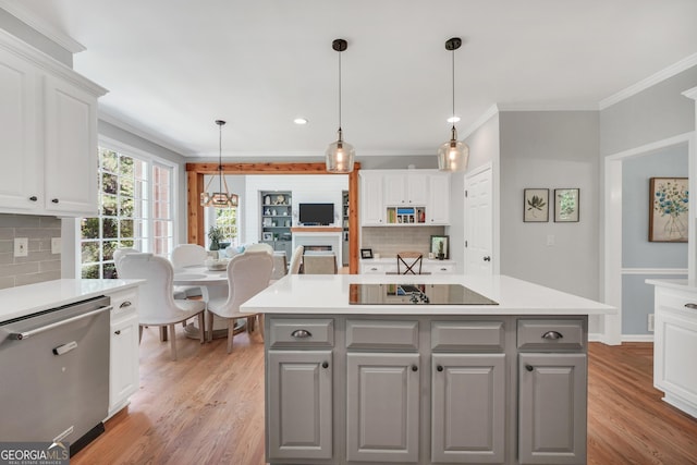 100 Castlebrook Chase, Tyrone, GA 30290 - kitchen with gray cabinets, stainless steel dishwasher, black electric cooktop, ornamental molding, and decorative backsplash