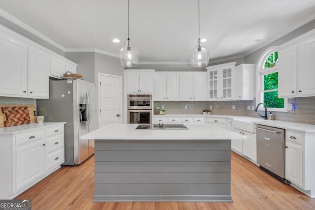 100 Castlebrook Chase, Tyrone, GA 30290 - kitchen with stainless steel appliances, ornamental molding, decorative backsplash, white cabinets, and light countertops
