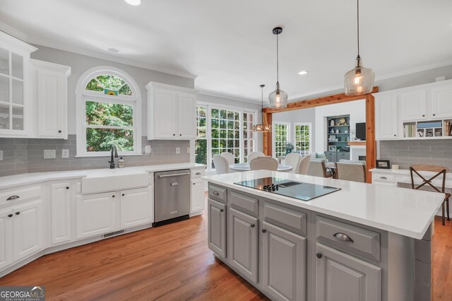 100 Castlebrook Chase, Tyrone, GA 30290 - kitchen featuring dishwasher, black electric stovetop, crown molding, backsplash, and white cabinets