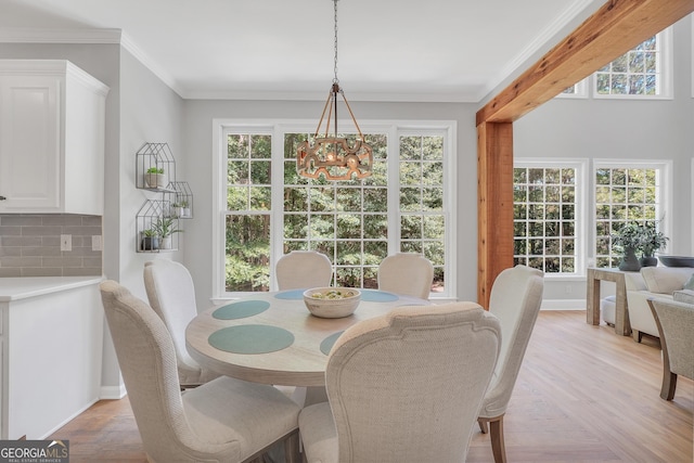 100 Castlebrook Chase, Tyrone, GA 30290 - dining room featuring a chandelier, light wood-style floors, and ornamental molding