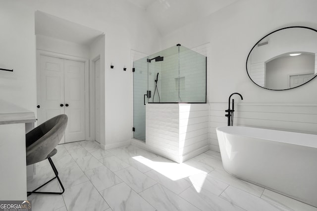 100 Castlebrook Chase, Tyrone, GA 30290 - bathroom featuring marble look tile flooring, a stall shower, and a freestanding bath