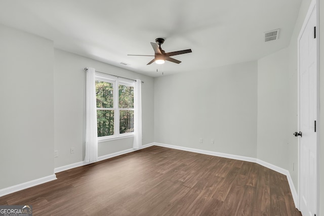 100 Castlebrook Chase, Tyrone, GA 30290 - spare room with a ceiling fan and dark wood-style flooring