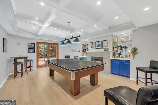 100 Castlebrook Chase, Tyrone, GA 30290 - recreation room featuring french doors, light wood-style floors, a brick fireplace, beam ceiling, and coffered ceiling