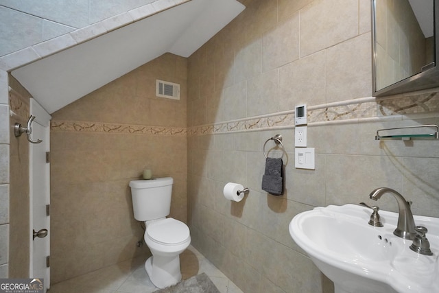 100 Castlebrook Chase, Tyrone, GA 30290 - half bath featuring tile walls, lofted ceiling, and tile patterned floors