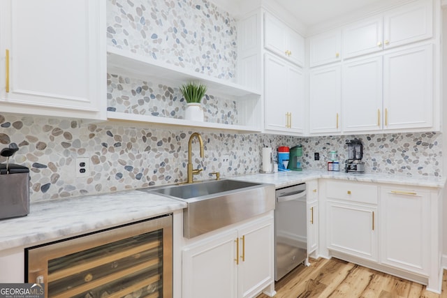 1112 Old Meadow Rd, Valdosta, GA 31605 - kitchen featuring dishwasher, beverage cooler, open shelves, tasteful backsplash, and light wood-style floors