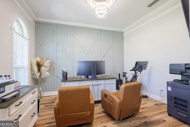 1112 Old Meadow Rd, Valdosta, GA 31605 - office space featuring ornamental molding, a decorative wall, a chandelier, and light wood-style flooring