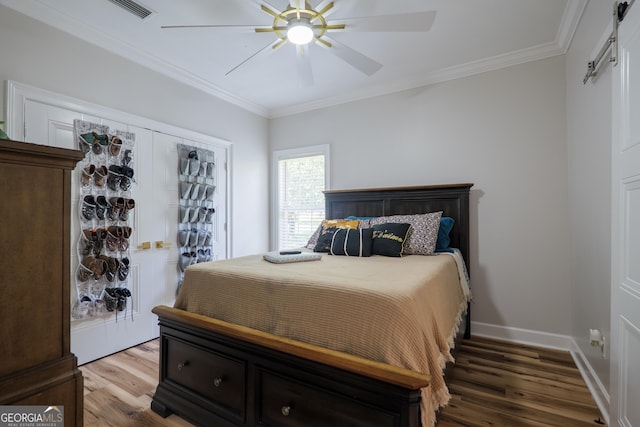1112 Old Meadow Rd, Valdosta, GA 31605 - bedroom featuring wood finished floors, crown molding, and a ceiling fan