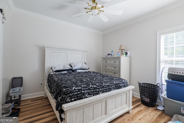 1112 Old Meadow Rd, Valdosta, GA 31605 - bedroom with wood finished floors, ornamental molding, and a ceiling fan