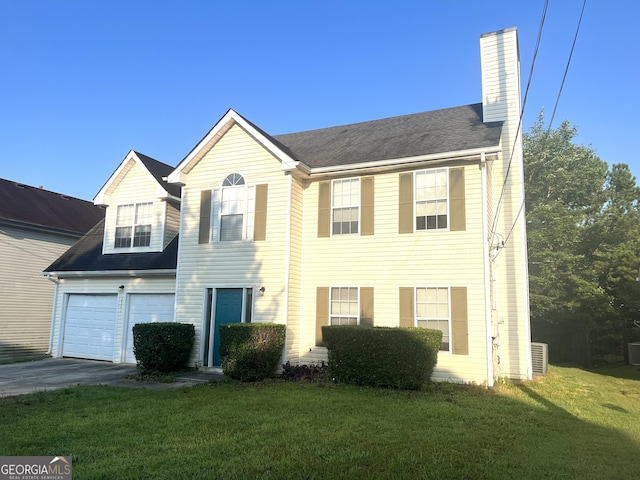 2561 Lancewood Ln, Lithonia, GA 30058 - view of front of house featuring a chimney, a front lawn, concrete driveway, and an attached garage