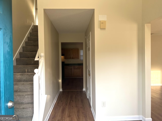 2561 Lancewood Ln, Lithonia, GA 30058 - hall featuring dark wood-type flooring and stairs