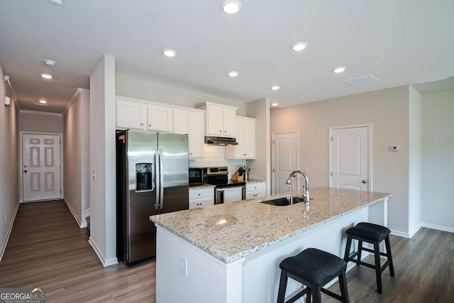428 Whitetail Cir, Canton, GA 30115 - kitchen with stainless steel appliances, under cabinet range hood, white cabinets, dark wood-style floors, and recessed lighting