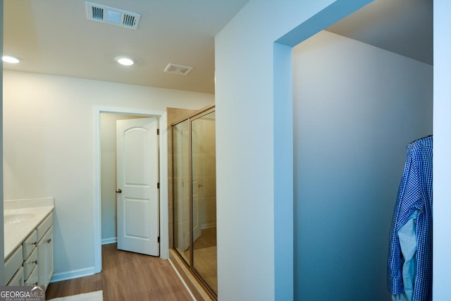 428 Whitetail Cir, Canton, GA 30115 - bathroom with vanity, a stall shower, wood finished floors, and recessed lighting