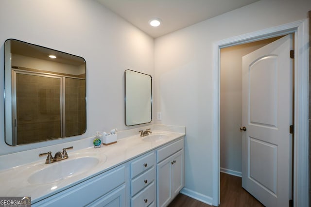 428 Whitetail Cir, Canton, GA 30115 - bathroom featuring double vanity, wood finished floors, a tile shower, and recessed lighting