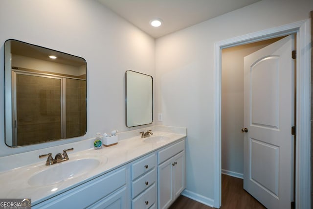 428 Whitetail Cir, Canton, GA 30115 - bathroom featuring double vanity, wood finished floors, a tile shower, and recessed lighting