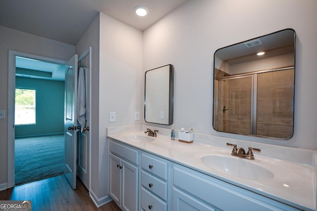 428 Whitetail Cir, Canton, GA 30115 - bathroom featuring double vanity, a tile shower, and wood finished floors