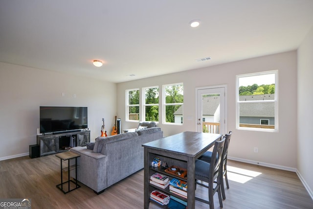 428 Whitetail Cir, Canton, GA 30115 - living area with wood finished floors, healthy amount of natural light, and recessed lighting