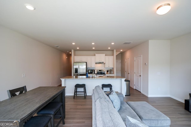 428 Whitetail Cir, Canton, GA 30115 - living area with dark wood-style flooring and recessed lighting