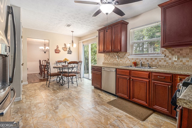 5086 N Woodbridge Trl, Stone Mountain, GA 30088 - kitchen featuring appliances with stainless steel finishes, tasteful backsplash, a ceiling fan, a textured ceiling, and pendant lighting