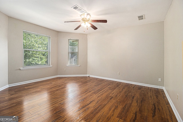 5086 N Woodbridge Trl, Stone Mountain, GA 30088 - spare room featuring ceiling fan and dark wood-style floors