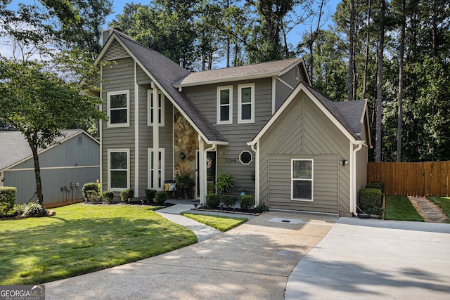 5086 N Woodbridge Trl, Stone Mountain, GA 30088 - view of front of house with a shingled roof and driveway