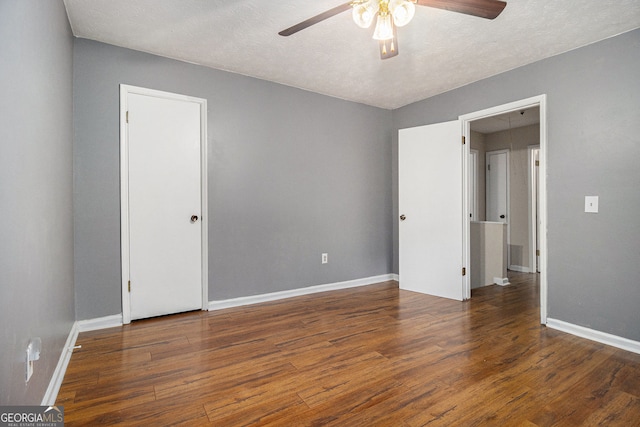 5086 N Woodbridge Trl, Stone Mountain, GA 30088 - unfurnished bedroom with wood finished floors and a ceiling fan
