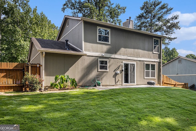 5086 N Woodbridge Trl, Stone Mountain, GA 30088 - back of property with a chimney and a patio