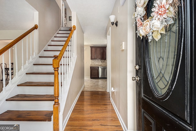 5086 N Woodbridge Trl, Stone Mountain, GA 30088 - entrance foyer with wood finished floors and stairway