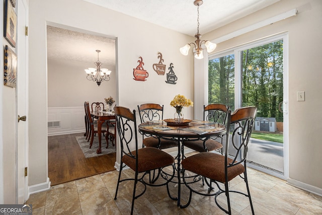 5086 N Woodbridge Trl, Stone Mountain, GA 30088 - dining space with a chandelier