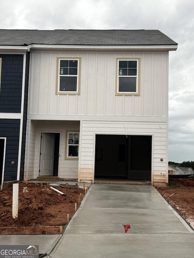 1344 Riverstone Rd Unit 108, Jonesboro, GA 30238 - view of front of property featuring board and batten siding, concrete driveway, and a shingled roof