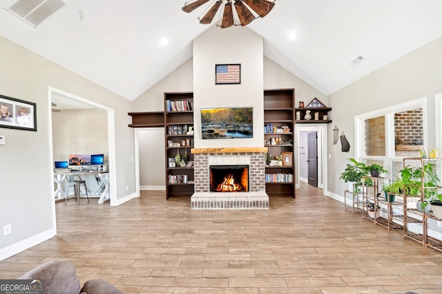 357 Old Driver Rd, Whitesburg, GA 30185 - living area featuring ceiling fan, high vaulted ceiling, light wood-style floors, a fireplace, and a desk