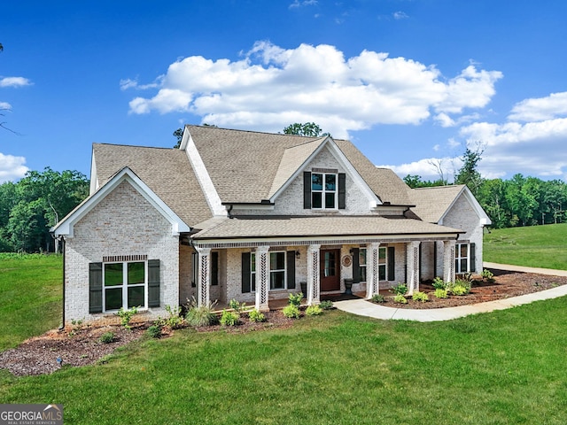 357 Old Driver Rd, Whitesburg, GA 30185 - view of front of home featuring brick siding, a front yard, a porch, and a shingled roof