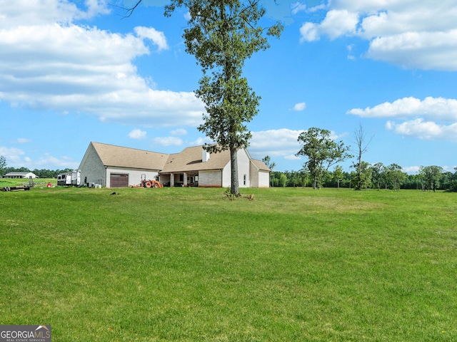 357 Old Driver Rd, Whitesburg, GA 30185 - view of grassy yard featuring a garage