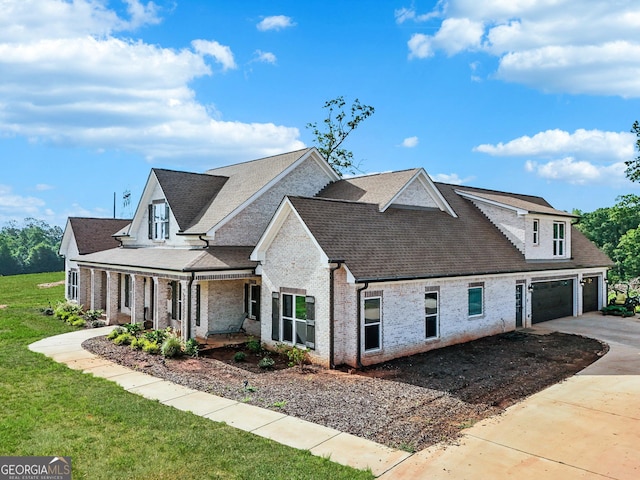 357 Old Driver Rd, Whitesburg, GA 30185 - view of home's exterior featuring concrete driveway, brick siding, roof with shingles, a yard, and a garage