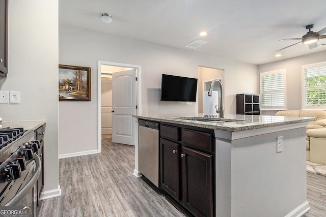 111 Point View Dr, Canton, GA 30114 - kitchen featuring stainless steel appliances, open floor plan, ceiling fan, light wood-style floors, and a center island with sink
