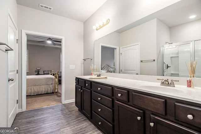 111 Point View Dr, Canton, GA 30114 - bathroom with connected bathroom, double vanity, wood finished floors, an enclosed shower, and ceiling fan