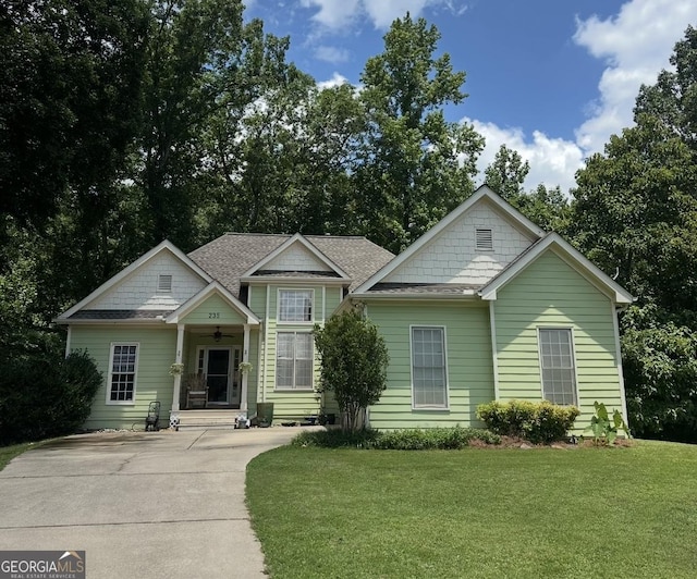 235 Pirkle Ct, Cumming, GA 30040 - view of front of home featuring a front lawn and a shingled roof