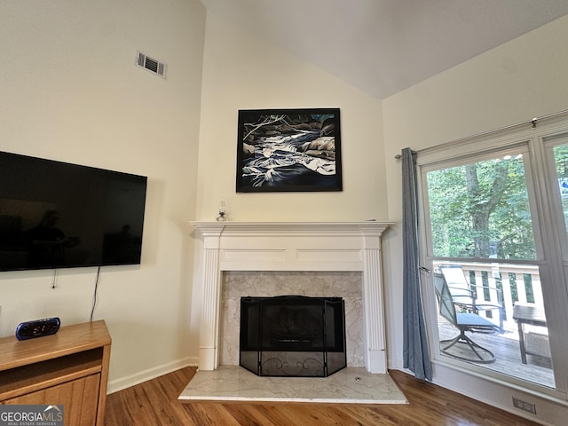 235 Pirkle Ct, Cumming, GA 30040 - living area featuring wood finished floors, a high end fireplace, and high vaulted ceiling
